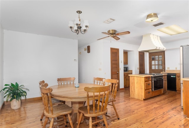 dining area featuring ceiling fan with notable chandelier and light wood-type flooring