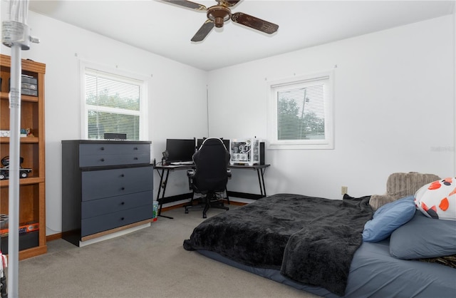 bedroom with light carpet and ceiling fan