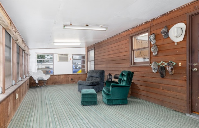 sunroom / solarium with an AC wall unit