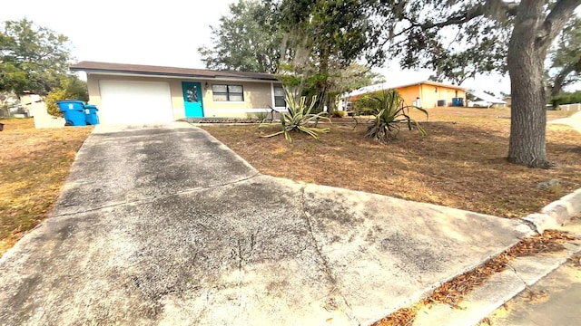 ranch-style house featuring a garage