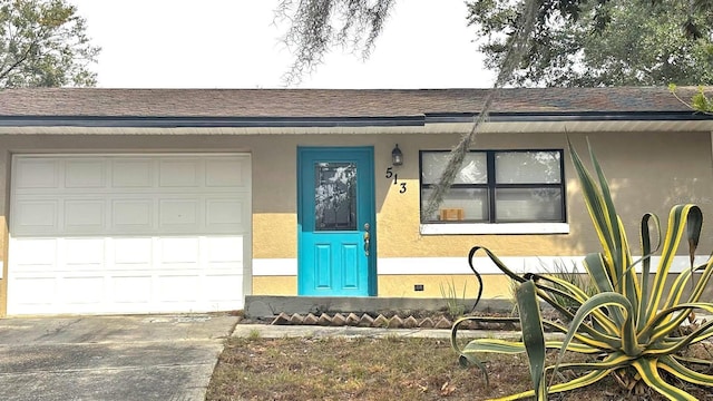 doorway to property featuring a garage