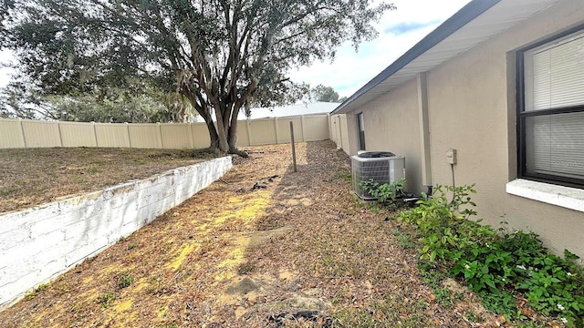 view of yard with central AC unit