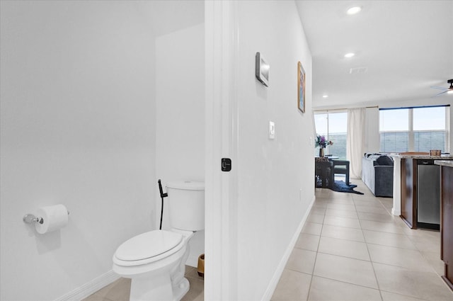 bathroom featuring toilet, recessed lighting, baseboards, and tile patterned floors