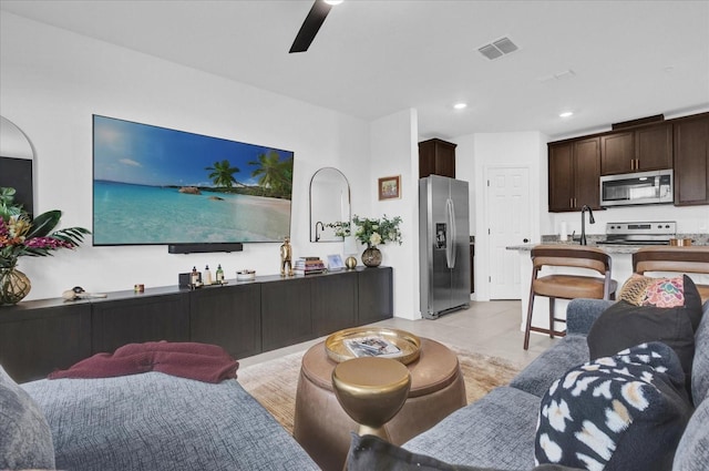 living room featuring recessed lighting, visible vents, ceiling fan, and light tile patterned flooring