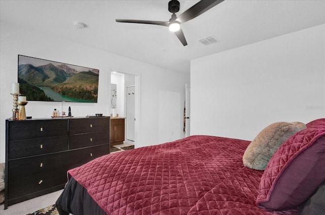 carpeted bedroom featuring ceiling fan and visible vents