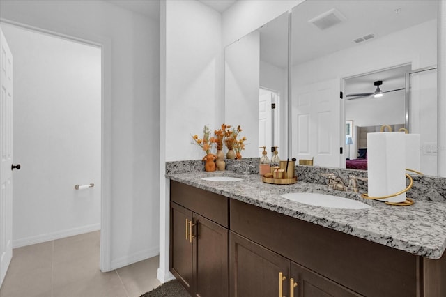 ensuite bathroom featuring double vanity, visible vents, a sink, ensuite bath, and tile patterned floors