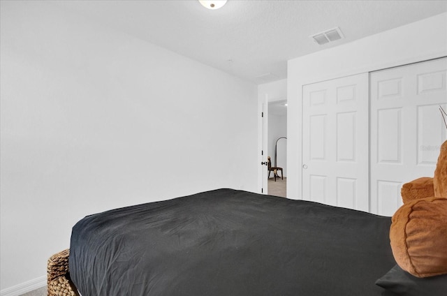 carpeted bedroom with visible vents