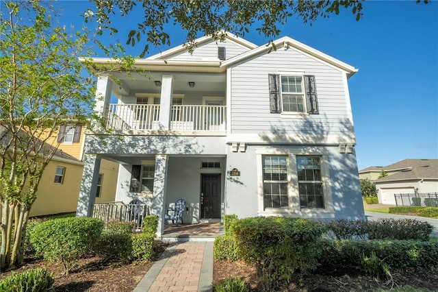 view of front of house featuring a balcony and a porch