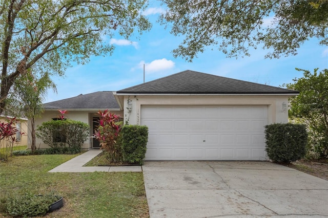 ranch-style house featuring a garage and a front yard