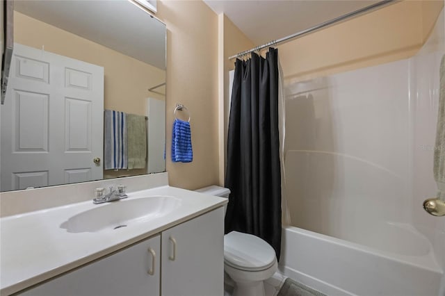 full bathroom with vanity, toilet, and shower / tub combo