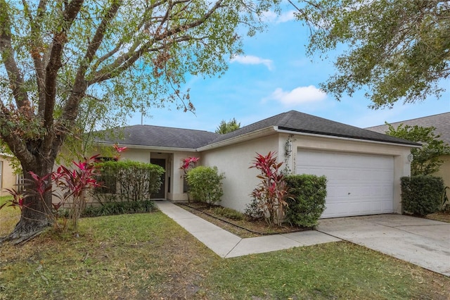 ranch-style house featuring a garage and a front lawn