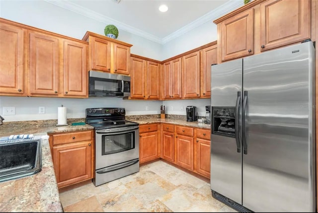 kitchen featuring appliances with stainless steel finishes, brown cabinets, light stone countertops, crown molding, and a sink