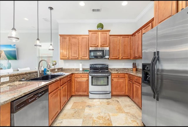 kitchen with light stone counters, a sink, ornamental molding, appliances with stainless steel finishes, and decorative light fixtures