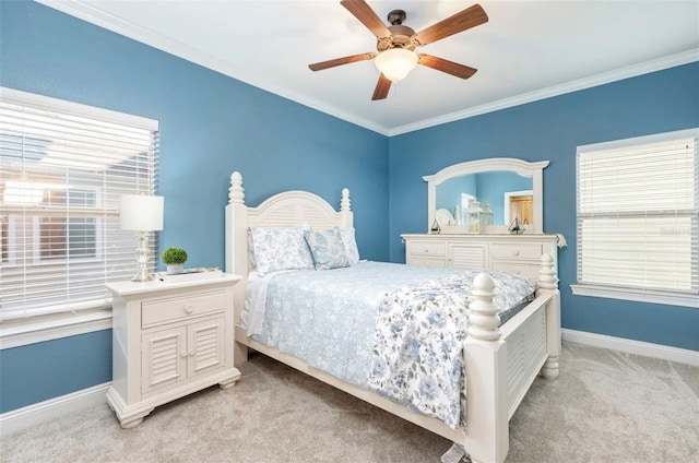 bedroom featuring ornamental molding, light colored carpet, ceiling fan, and baseboards