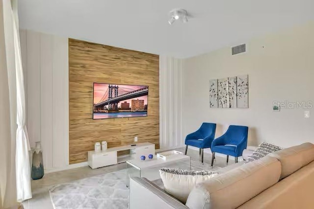 living room with wooden walls