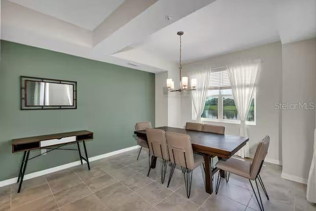 dining room with a chandelier