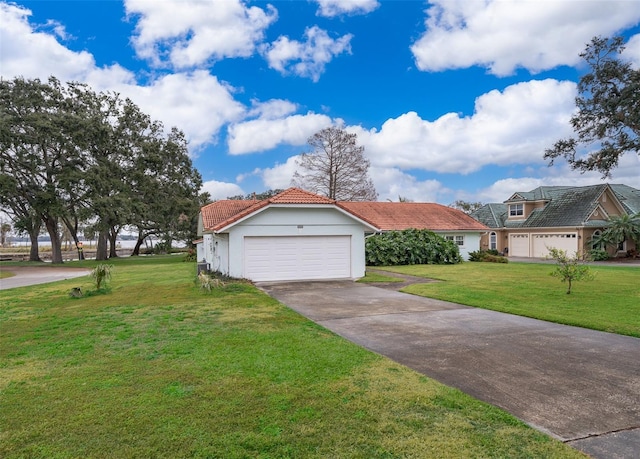 view of front of home featuring a garage and a front lawn