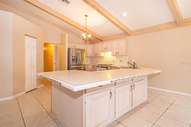 kitchen featuring stainless steel fridge with ice dispenser, sink, hanging light fixtures, light tile patterned floors, and kitchen peninsula