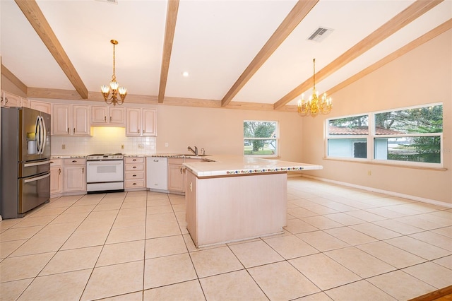 kitchen with stove, hanging light fixtures, an inviting chandelier, and stainless steel refrigerator with ice dispenser