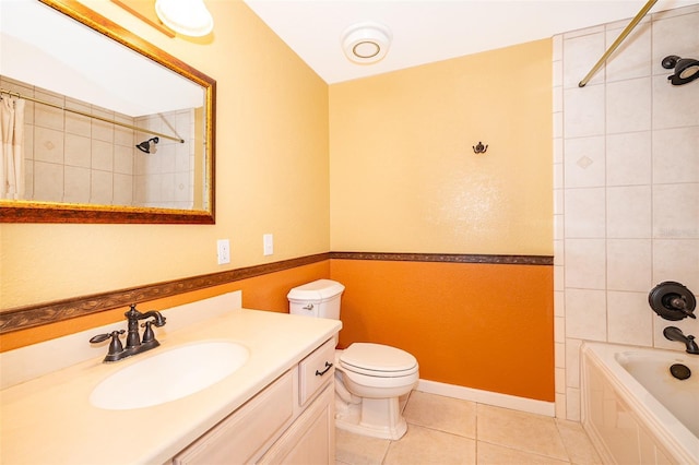 full bathroom with tiled shower / bath, vanity, toilet, and tile patterned flooring