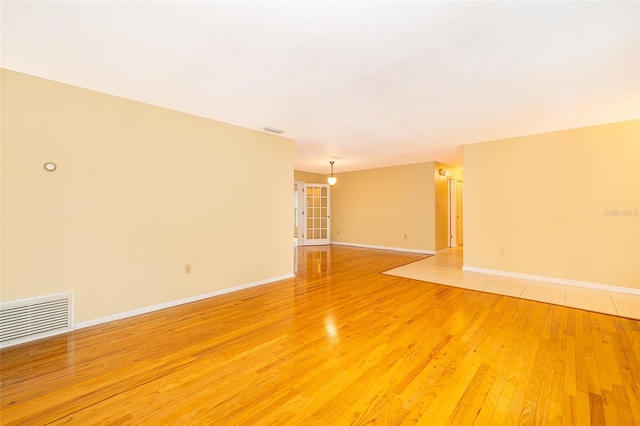 empty room with light wood-type flooring