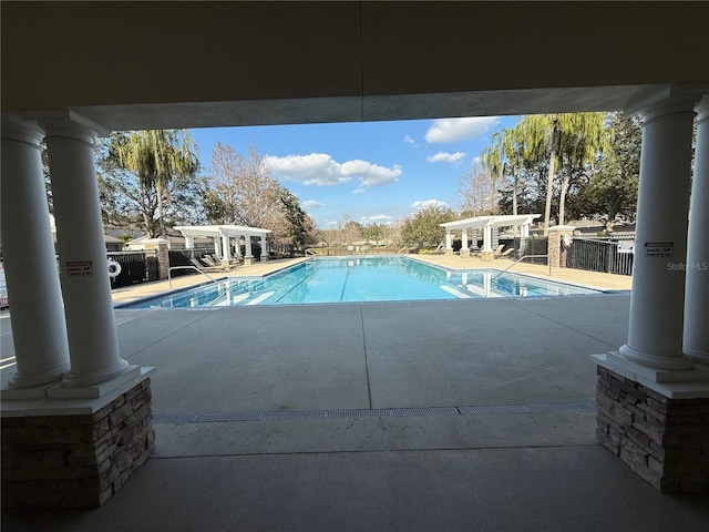 view of swimming pool with a pergola and a patio