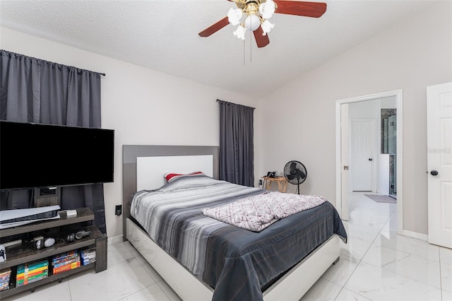 bedroom with a textured ceiling, vaulted ceiling, and ceiling fan