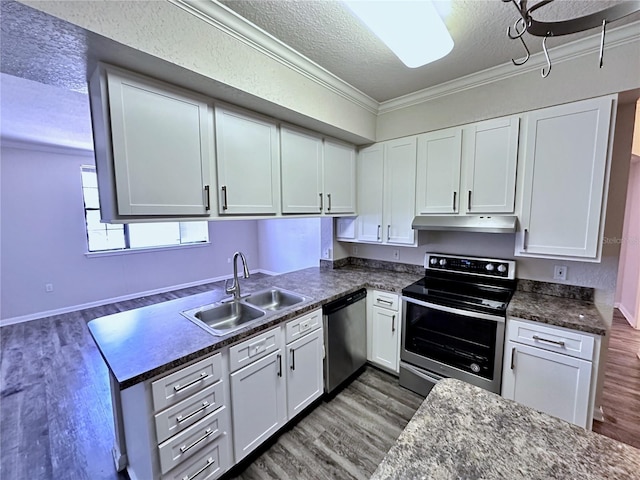 kitchen with sink, stainless steel appliances, ornamental molding, a textured ceiling, and white cabinets