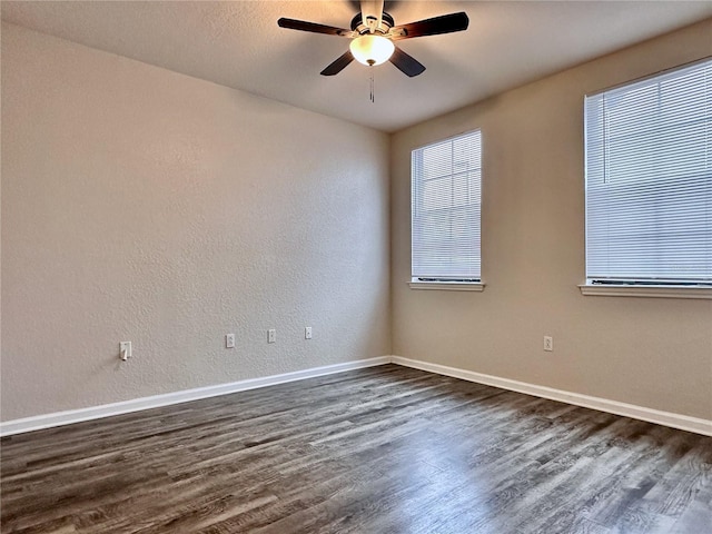 unfurnished room featuring dark hardwood / wood-style floors and ceiling fan