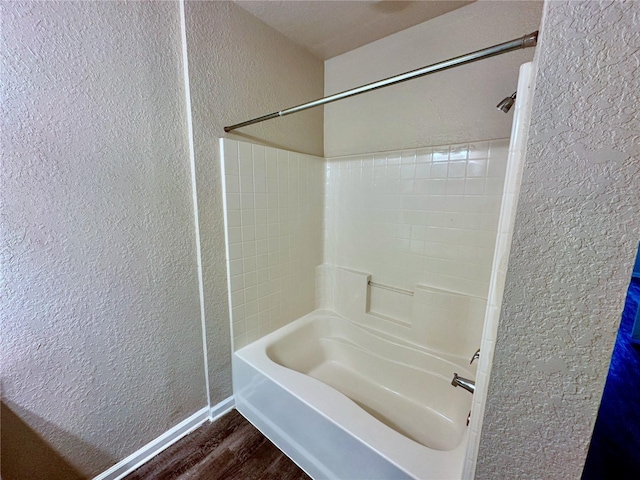 bathroom featuring hardwood / wood-style floors and shower / bathing tub combination