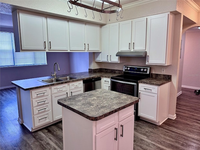 kitchen with sink, a center island, white cabinets, and appliances with stainless steel finishes