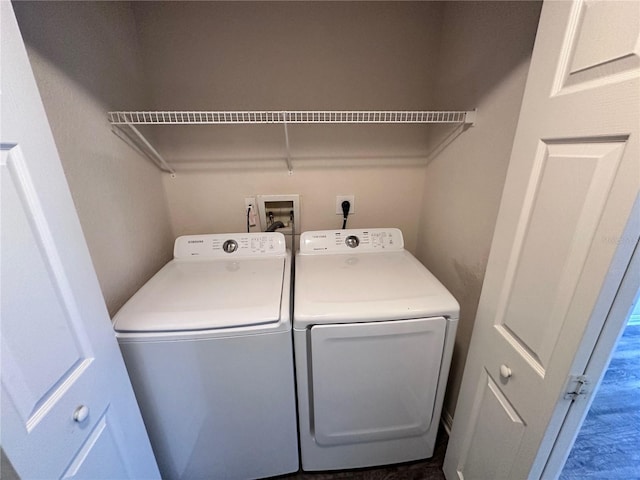 laundry area with washing machine and clothes dryer