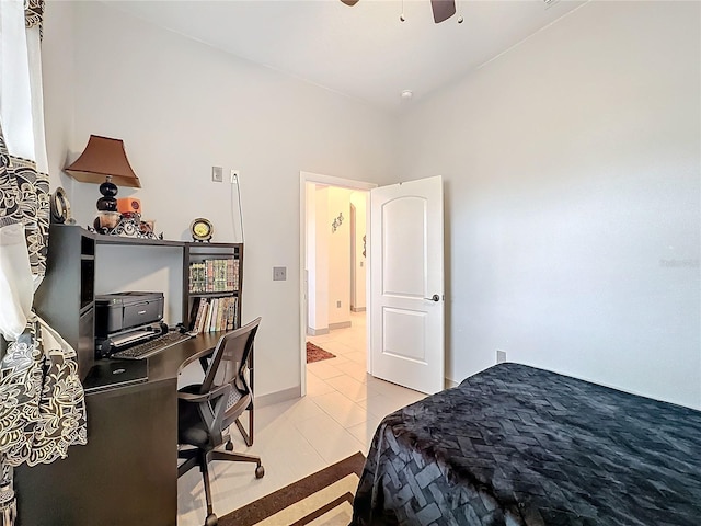 bedroom with light tile patterned floors and ceiling fan