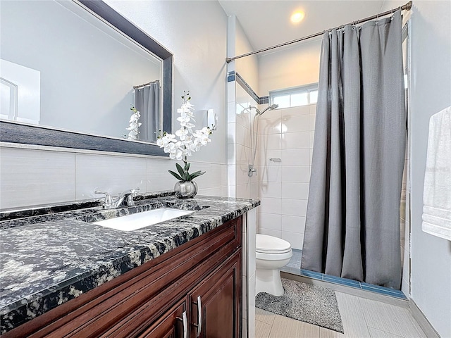 bathroom featuring vanity, toilet, and walk in shower