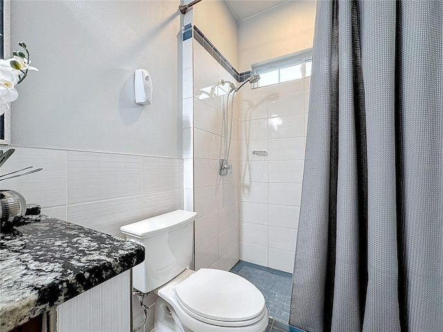 bathroom with a shower with curtain, tile walls, and toilet