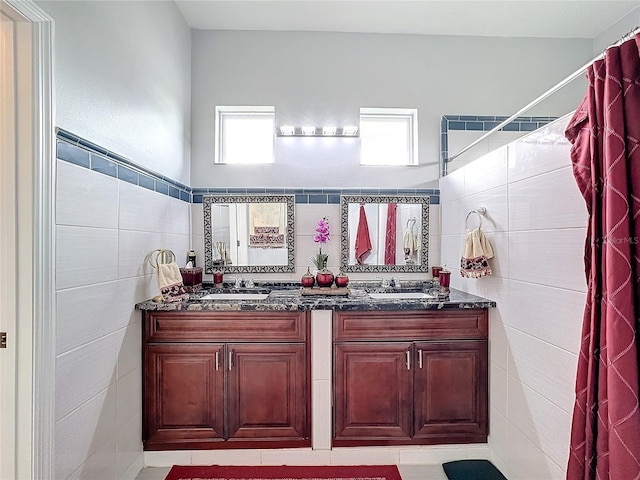 bathroom with vanity, tile walls, tile patterned floors, and a shower with shower curtain