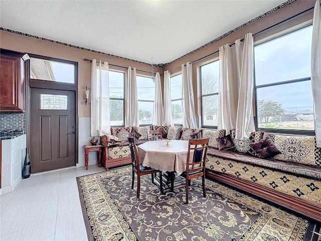 dining room featuring a textured ceiling