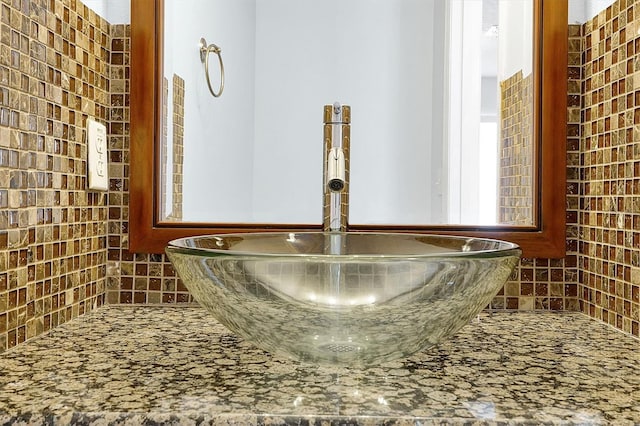 details with a hot tub, sink, and decorative backsplash