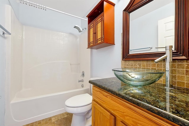 full bathroom with tile patterned flooring, tasteful backsplash, vanity, shower / bathtub combination, and toilet