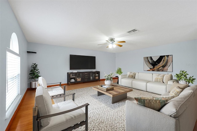 living room with ceiling fan and wood-type flooring