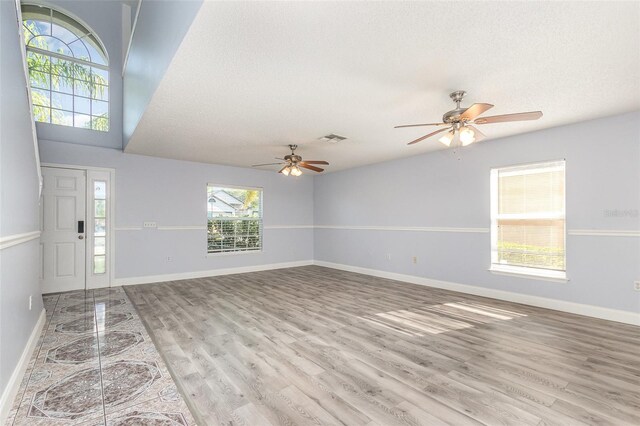 1633 Corner Meadow Cir, Orlando, FL 32820 - foyer entrance with a ceiling fan, wood finished floors, baseboards, and a textured ceiling