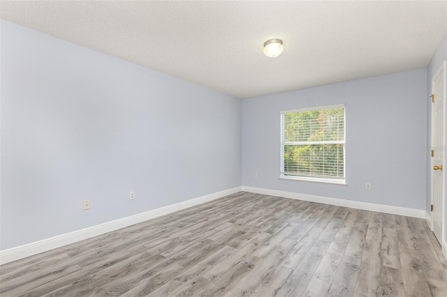 1633 Corner Meadow Cir, Orlando, FL 32820 - empty room featuring wood finished floors and baseboards