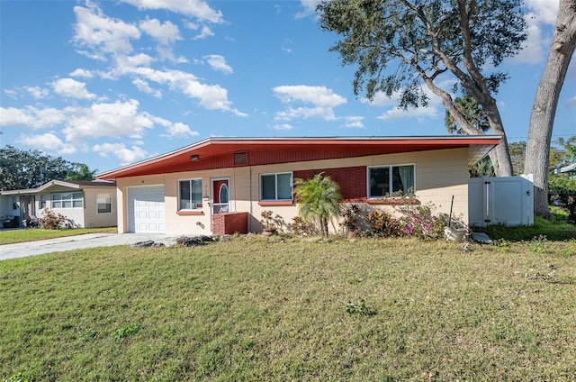 ranch-style house with a garage and a front yard