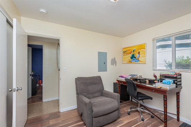 home office featuring electric panel and hardwood / wood-style floors