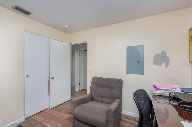 office space featuring hardwood / wood-style flooring and electric panel