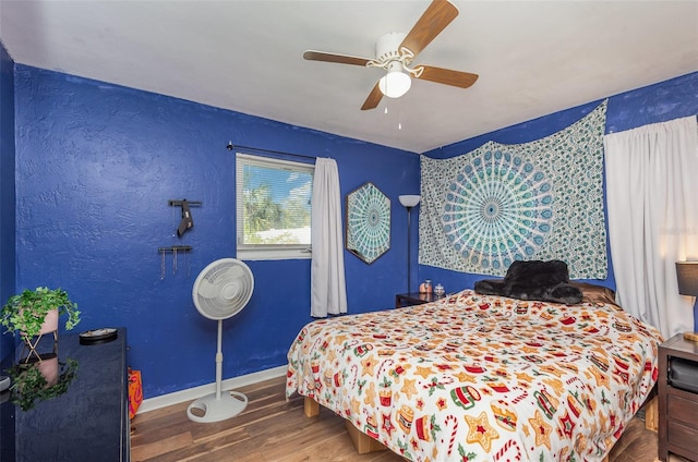 bedroom featuring ceiling fan and hardwood / wood-style floors