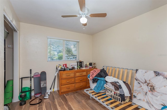 bedroom with dark wood-type flooring and ceiling fan