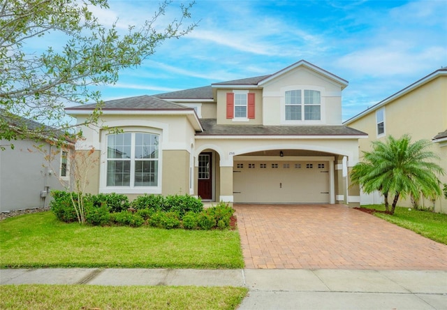 view of front facade featuring a front yard and a garage