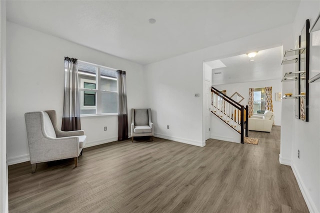 unfurnished room with hardwood / wood-style flooring