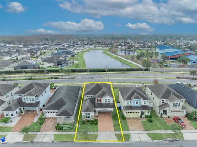 birds eye view of property with a water view